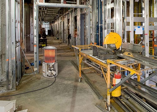 Construction heater on site providing heat for worker