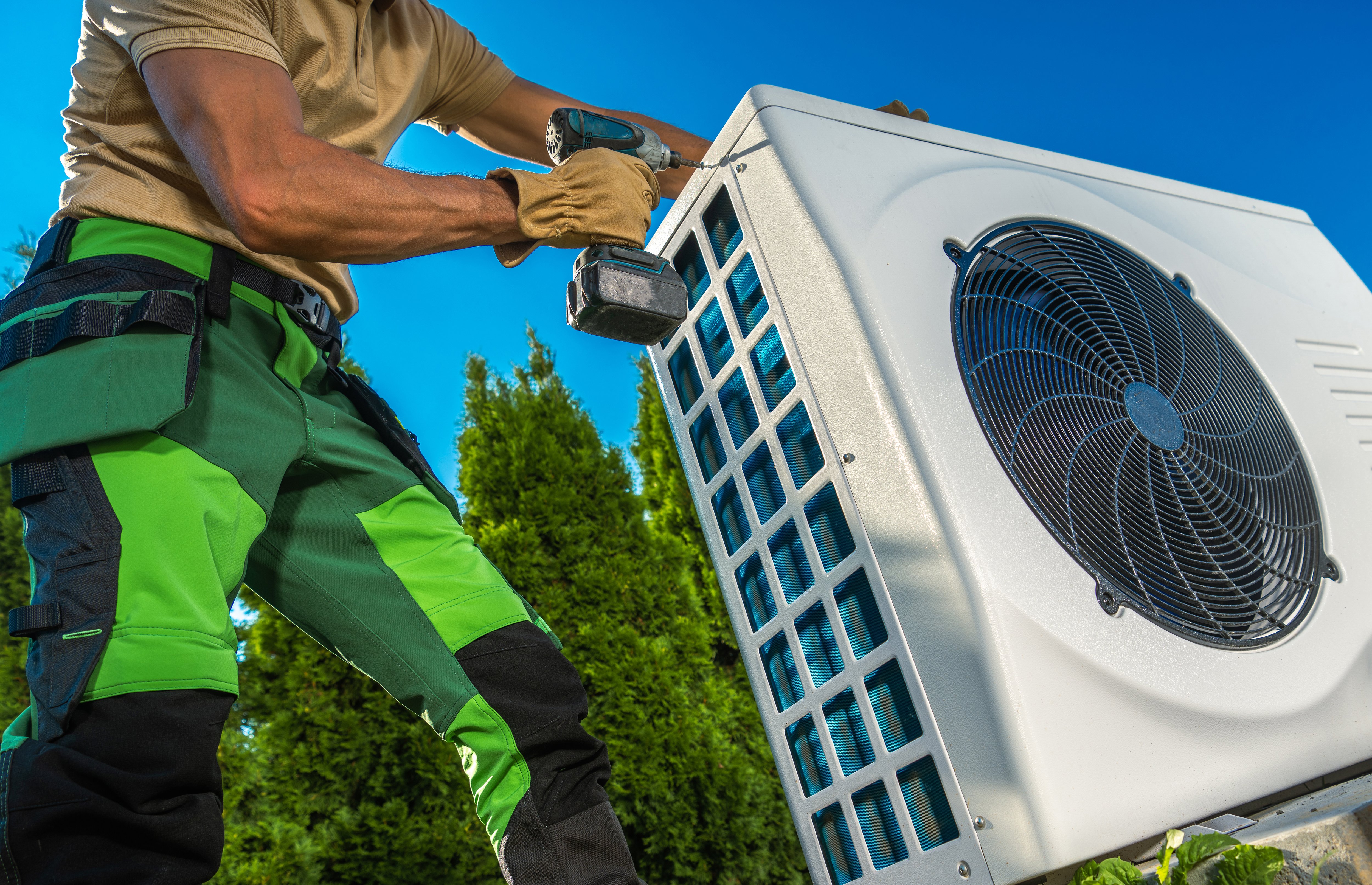 hvac-technician-installing-large-modern-heat-pump-2022-08-22-23-40-41-utc